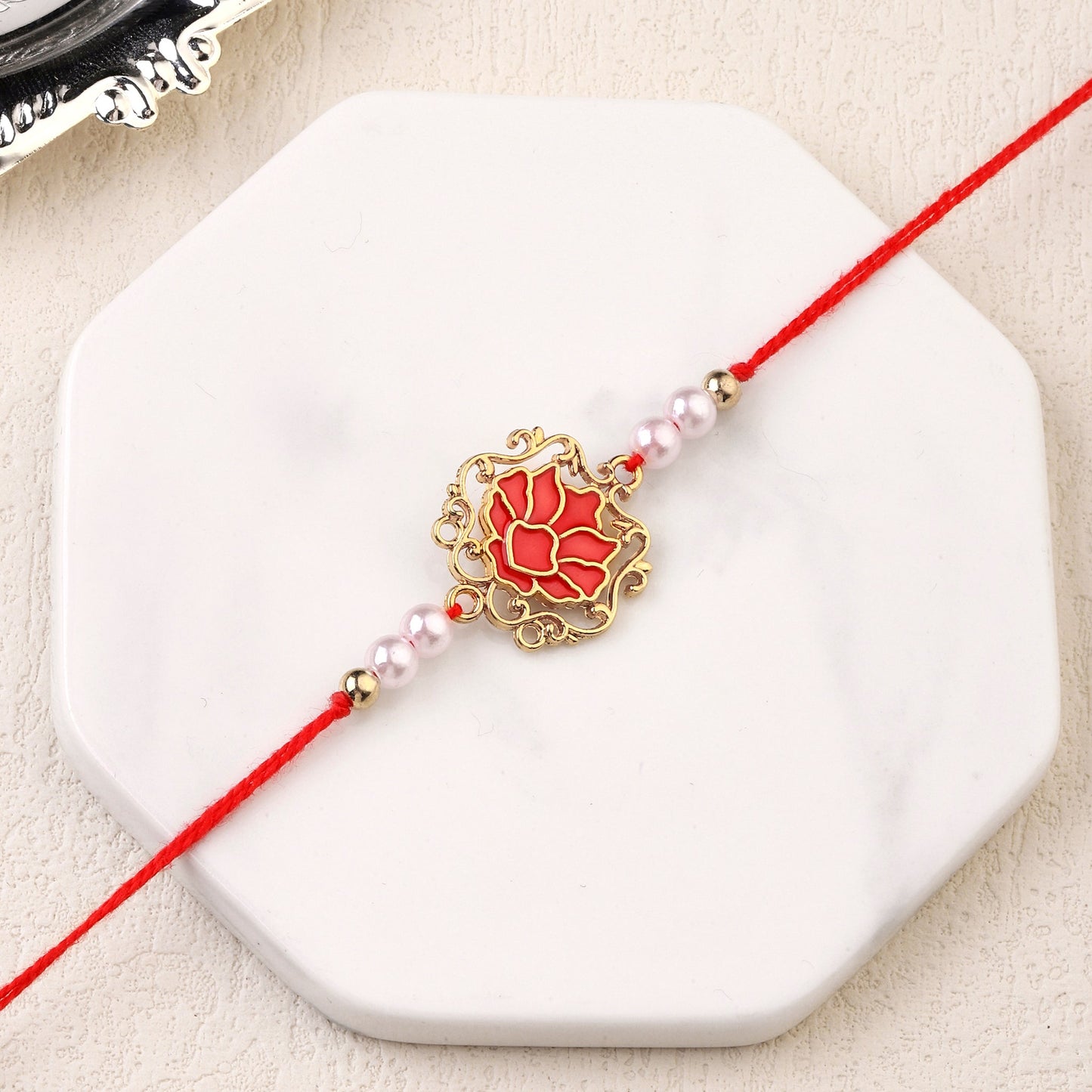 Tranquil Red Lotus Pearl Rakhi